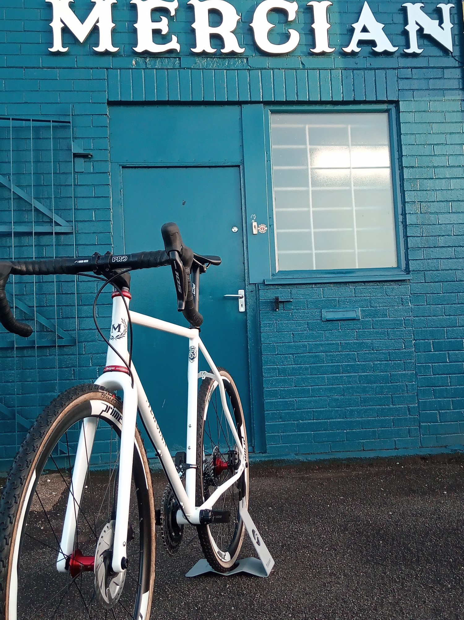 A Reynolds 853 steel Mercian Ventura Allroad bike outside the Pontefract Street workshop