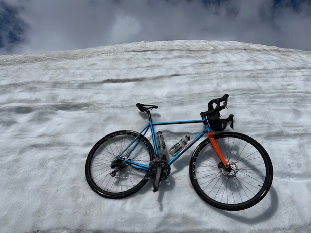 Mercian Pro Lugless steel road bike in front of a Norwegian snow bank